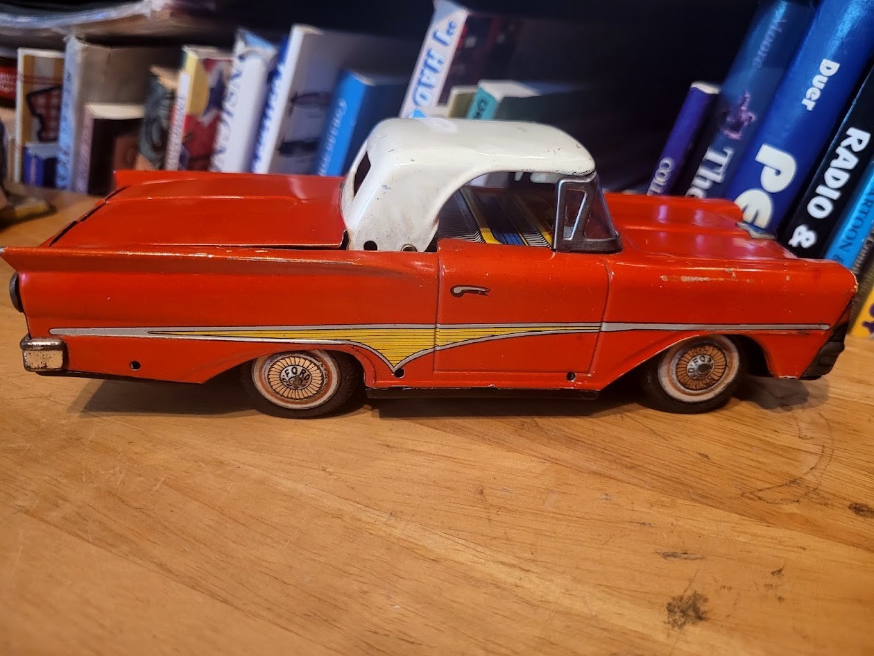 NICE RED NOMURA TIN LITHO FRICTION POWERED 1958 FORD SKYLINER RETRACTABLE HDTP