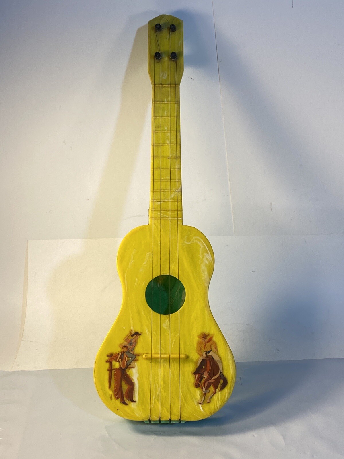 Vintage Toy 15” Uke A Doodle Marbled Yellow and Green Plastic W/Cowboys c1947