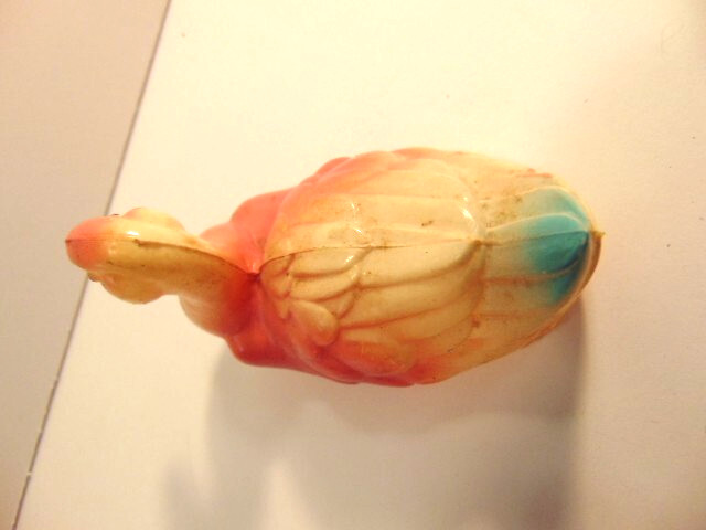 small vintage pinkish celluloid duck (about 4 inches long)