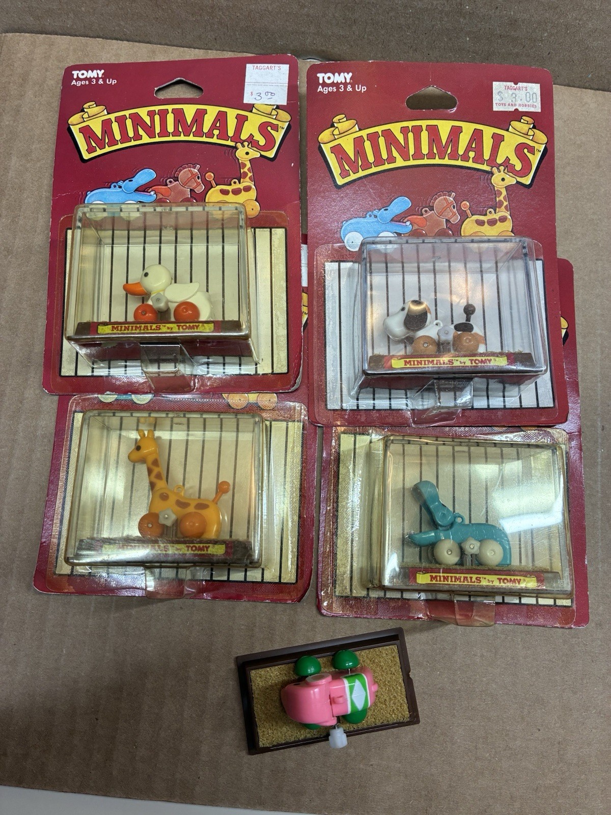 TOMY wind up tory Minimals duck , dog, hippo , giraffe 5 total, 4 sealed.