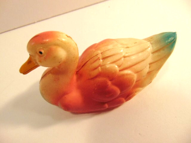 small vintage pinkish celluloid duck (about 4 inches long)