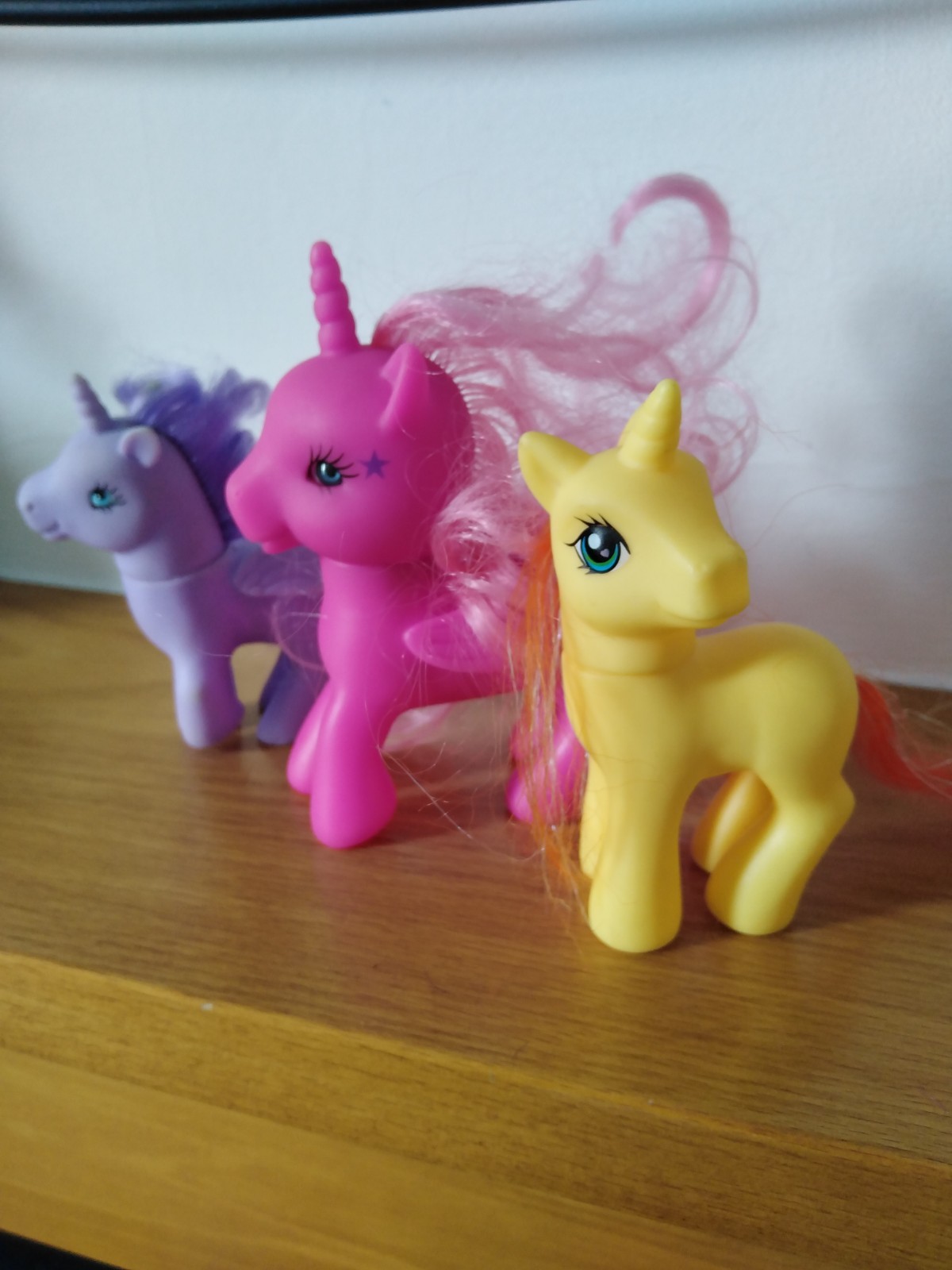 3 Uunicorn ponies one pink 5 inch .The yellow and Lilac ponies are 4 inch