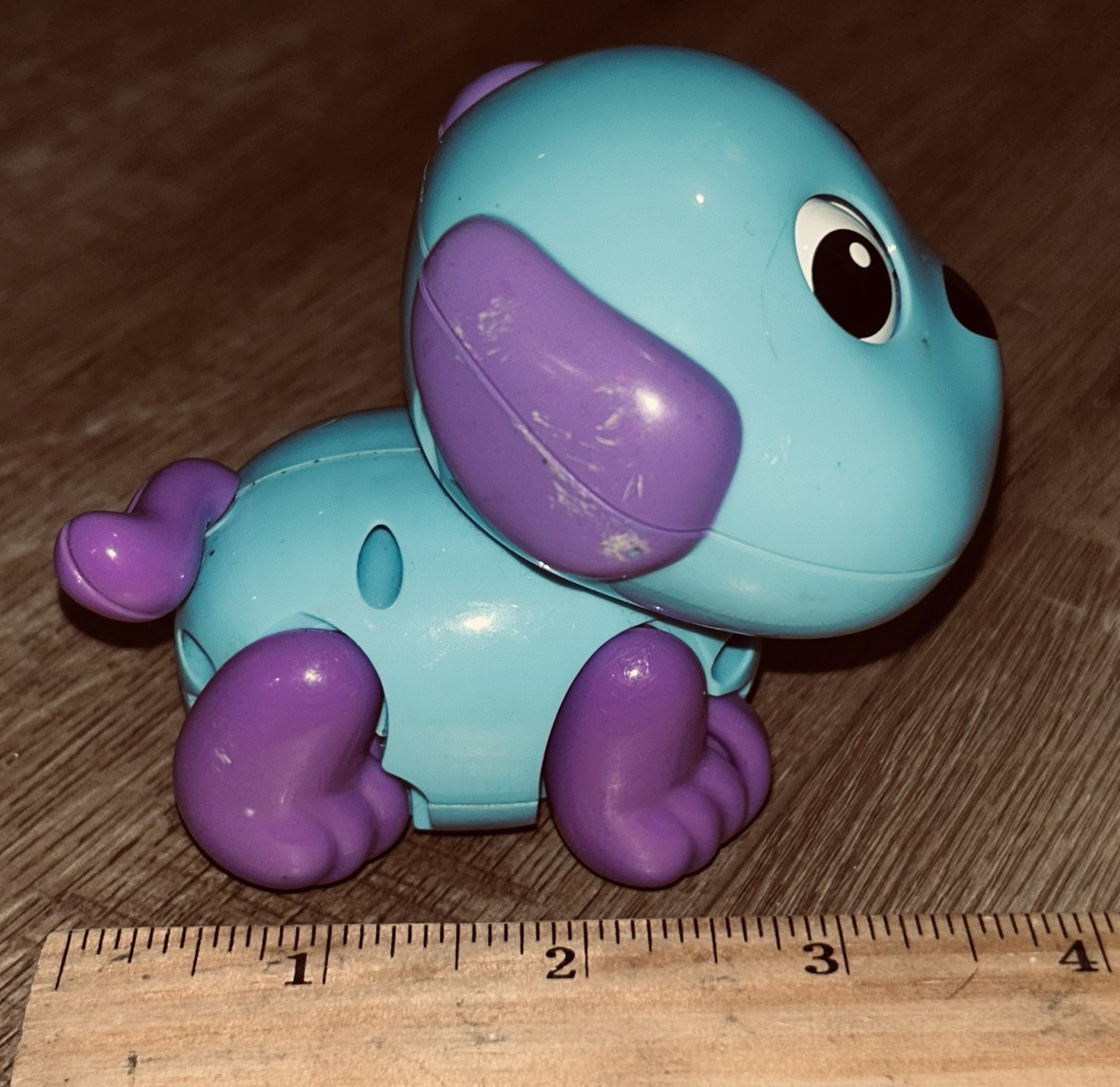 Blue and purple “Funny Happy Dog” wind-up toy made by PMT Holdings