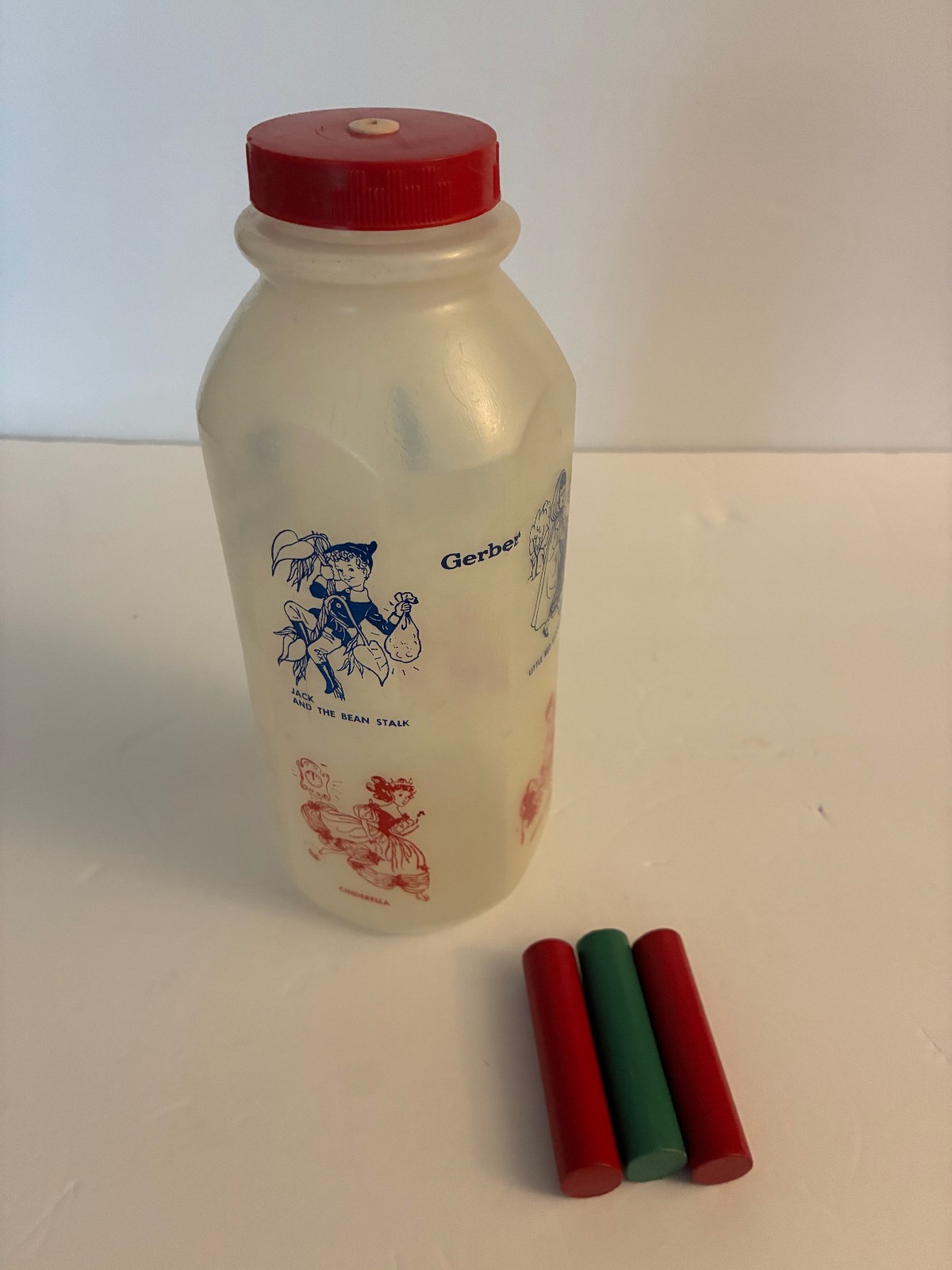 Vintage GERBER Squeaker Toy Baby Bottle With Wood Pegs & Nursery Rhymes