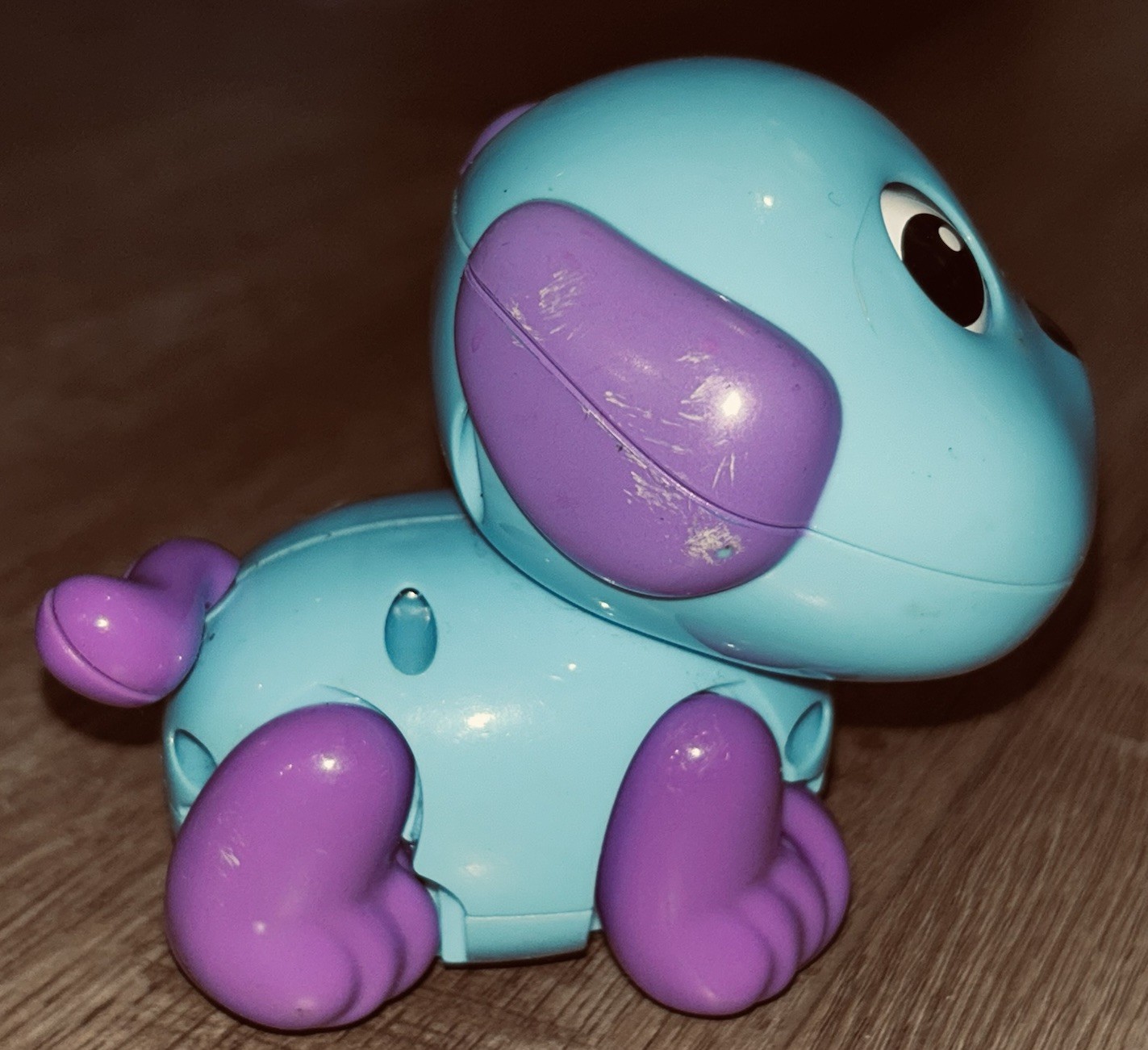 Blue and purple “Funny Happy Dog” wind-up toy made by PMT Holdings