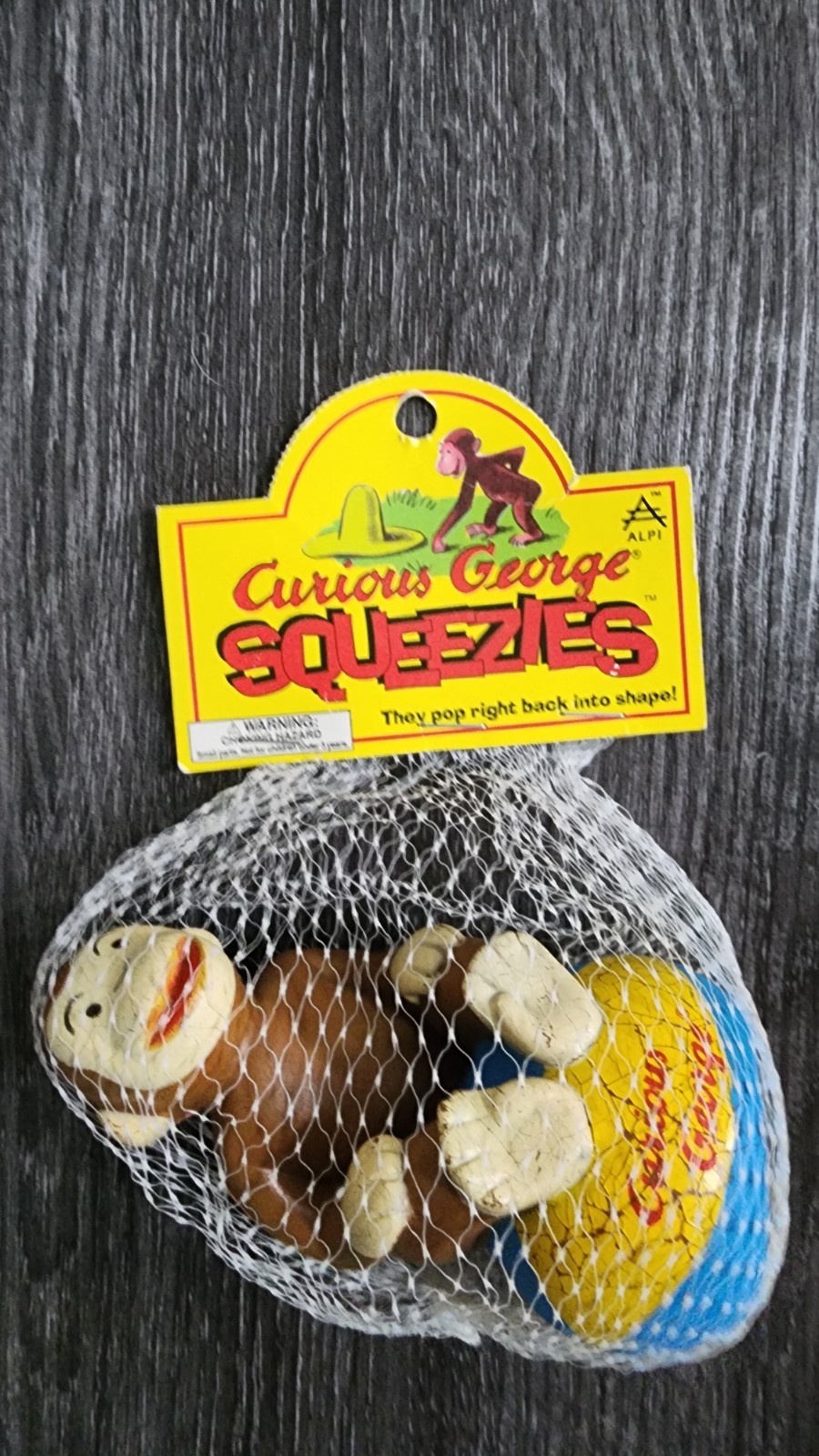 Vintage Curious George 1997 Squeezie Toy still in packaging