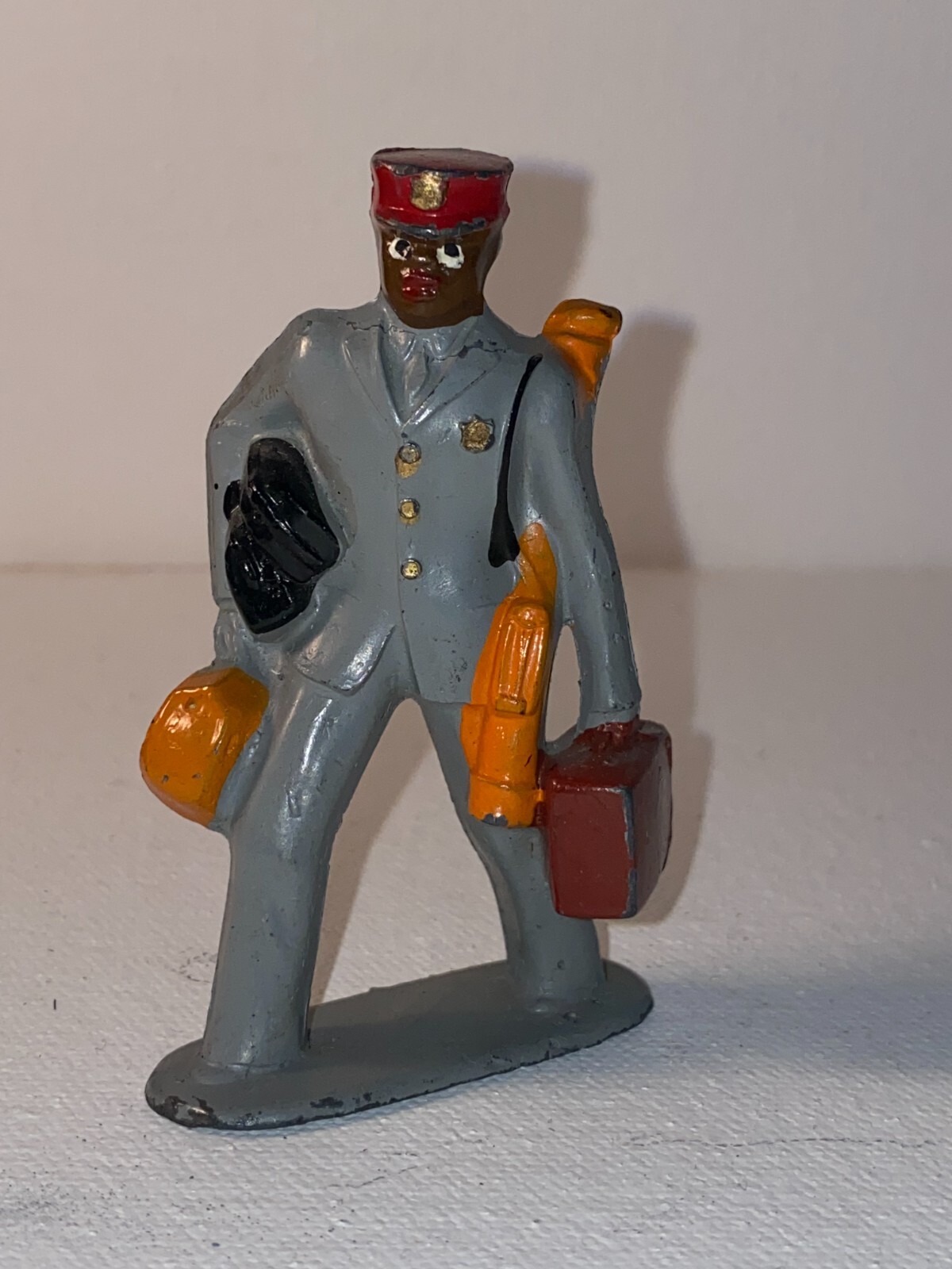VINTAGE MINIATURE HOTEL EMPLOYEE CAST LEAD FIGURINE (2.5” TALL)