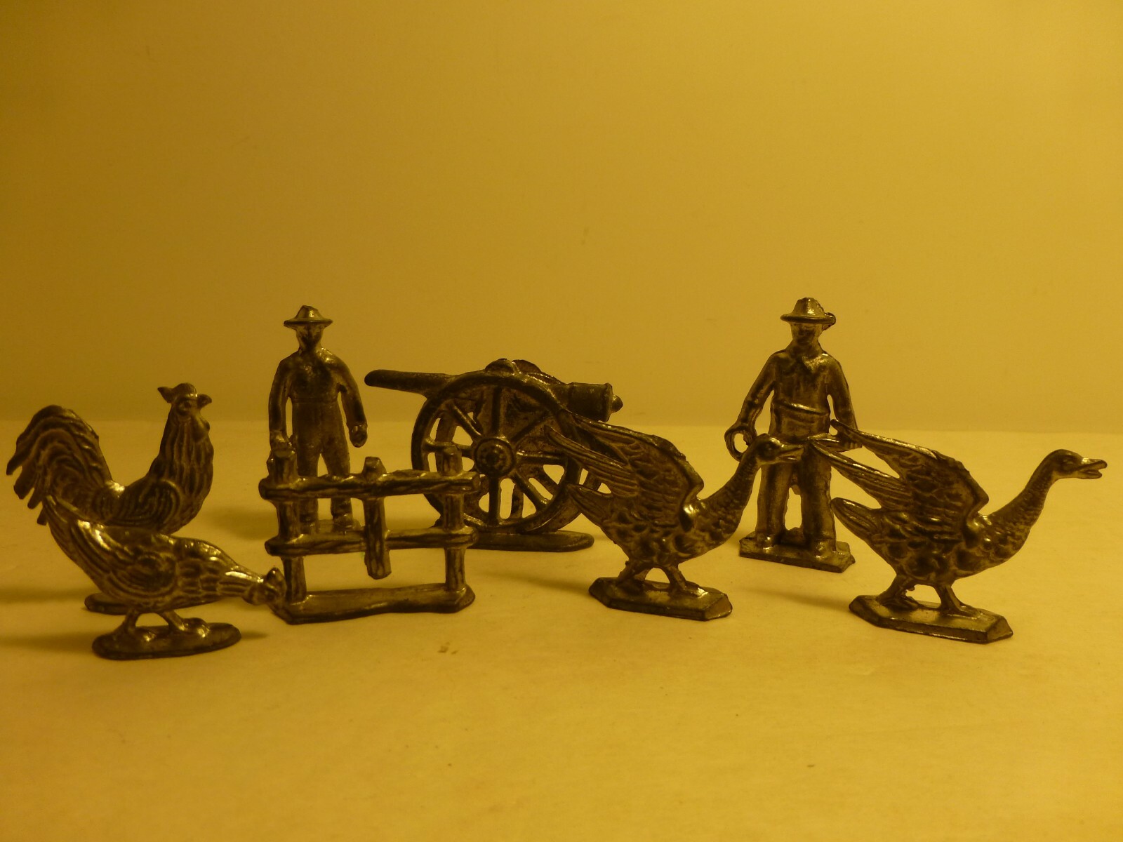 Eight Vintage Lead Figures Unfinished Cannon, Two Men, Fence and Various Animals